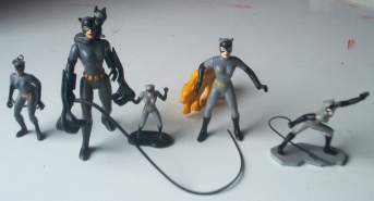 photo of Catwoman collectibles, some with whip, from Batman Animated series.