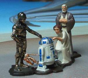 Princess Leia Organa (Carrie Fisher) and Ben (Obi-Wan) Kenobi (Alec Guinness) iron collectibles.